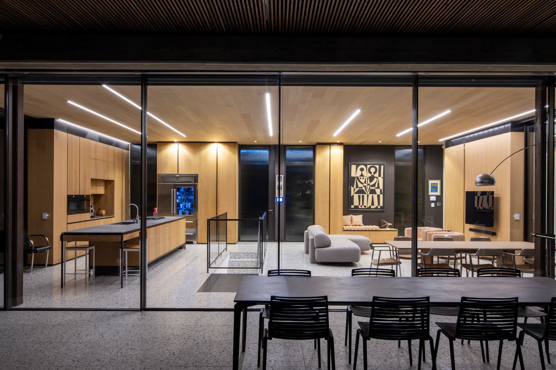 Kitchen and living room lit at night